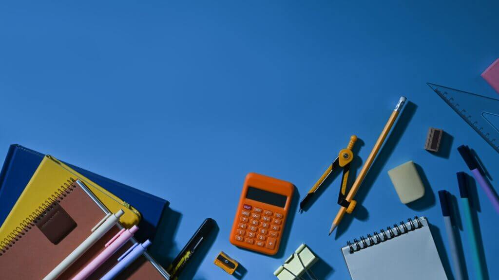 top view of various school supplies on a blue back 2022 10 20 22 09 38 utc