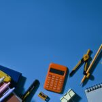 top view of various school supplies on a blue back 2022 10 20 22 09 38 utc